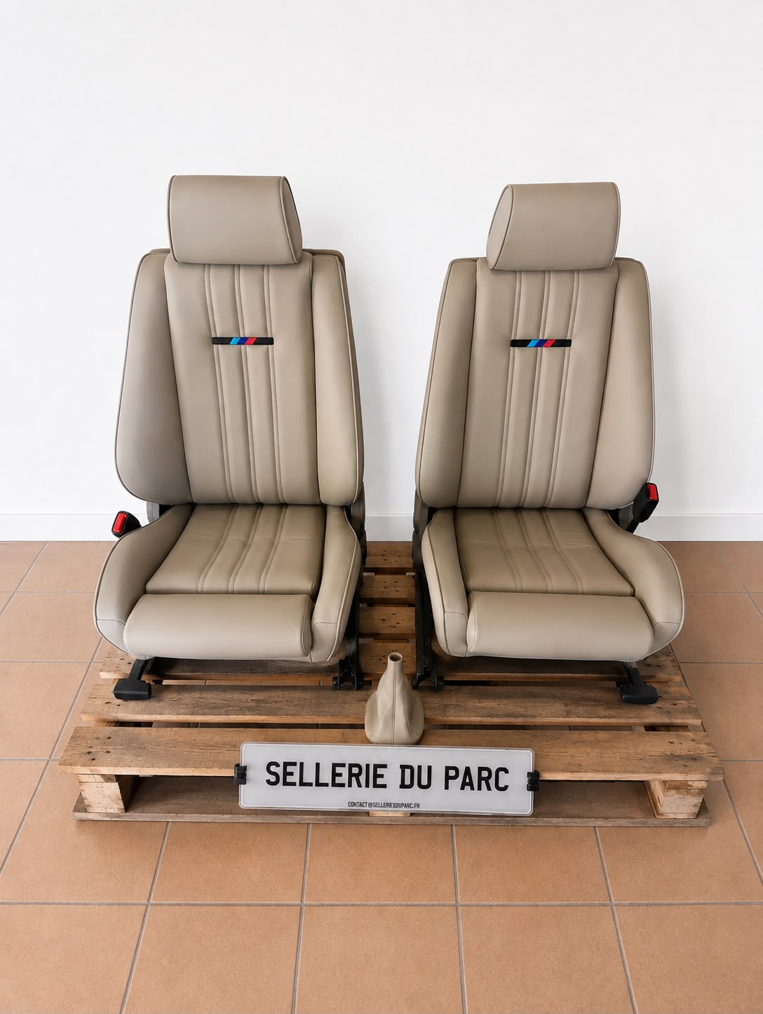 Two restored car seats ready to be transported by Sellerie du Parc
